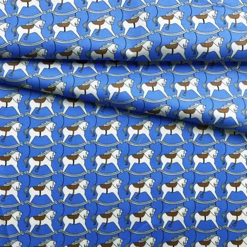 Ткань Хлопок  голубого цвета с принтом  лошадь-качалка 14434